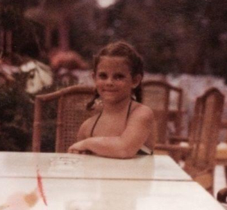 Me as a young traveler in long braids and summer dress, my first trip to Acapulco with my family in the 1980s. I'm pretty sure Tom Carpenter took this photo of me sitting at a table (the rest of my family is cropped out).